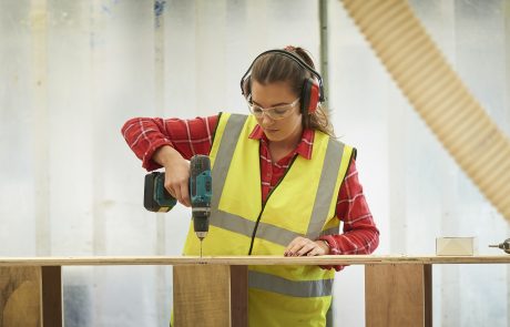 girl drilling timber